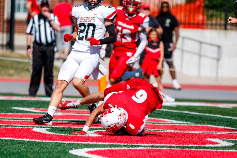 a football player falling on the ground