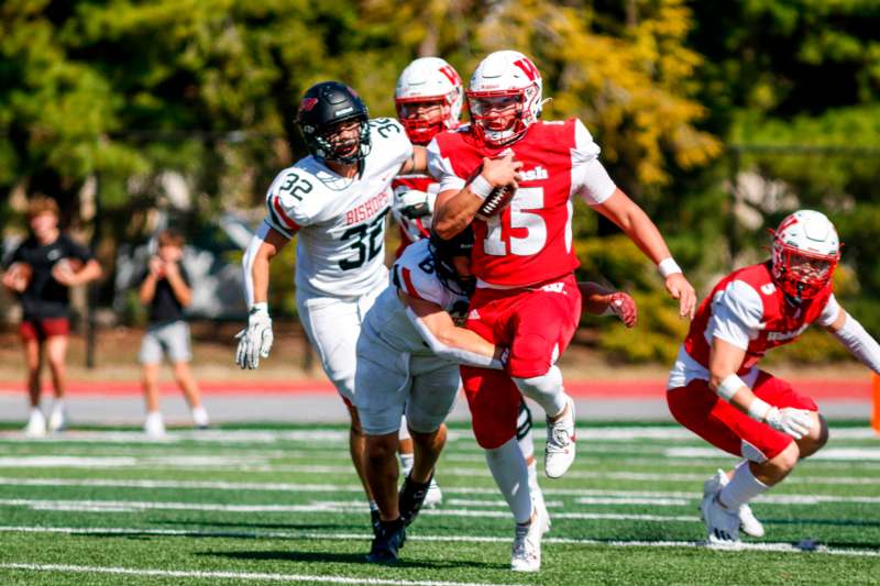 a football player running with another player in the back