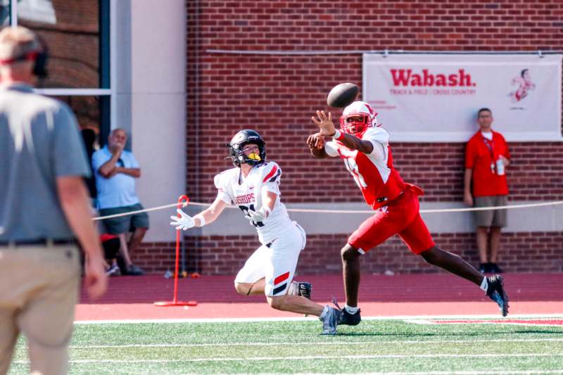 a football player catching a football