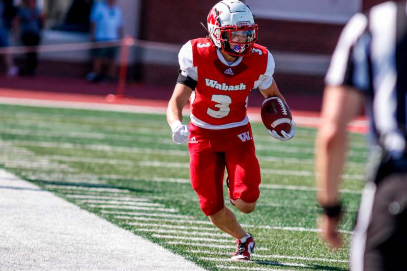 a football player running on a field