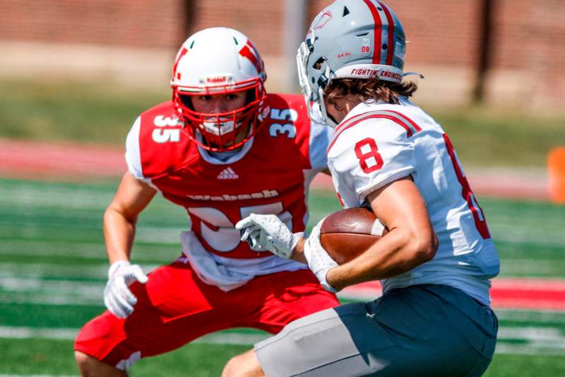 a football players running with a football