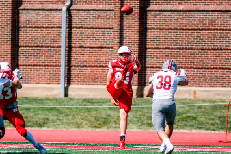 a football player catching a football