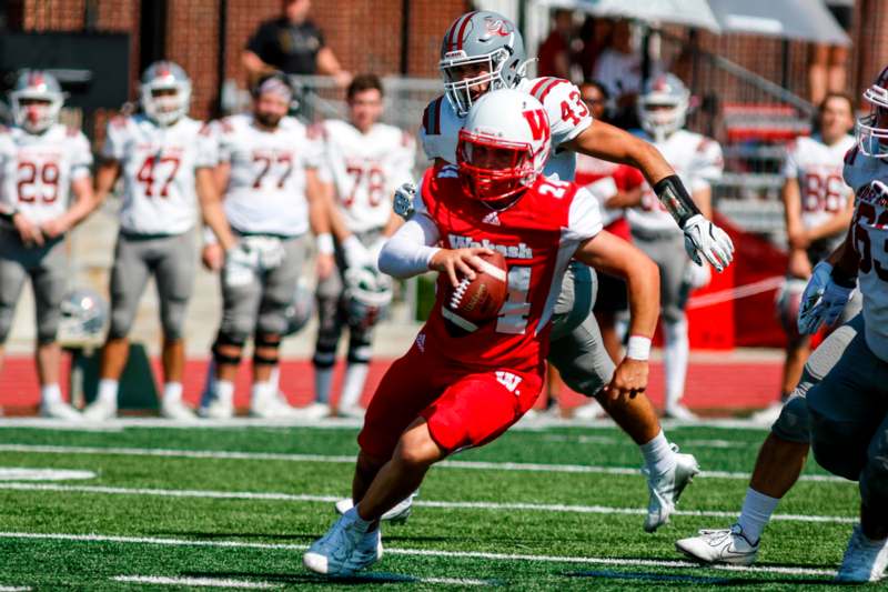 a football player running with the ball