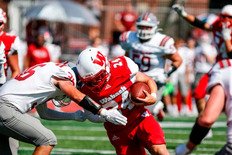 a football player running with the ball