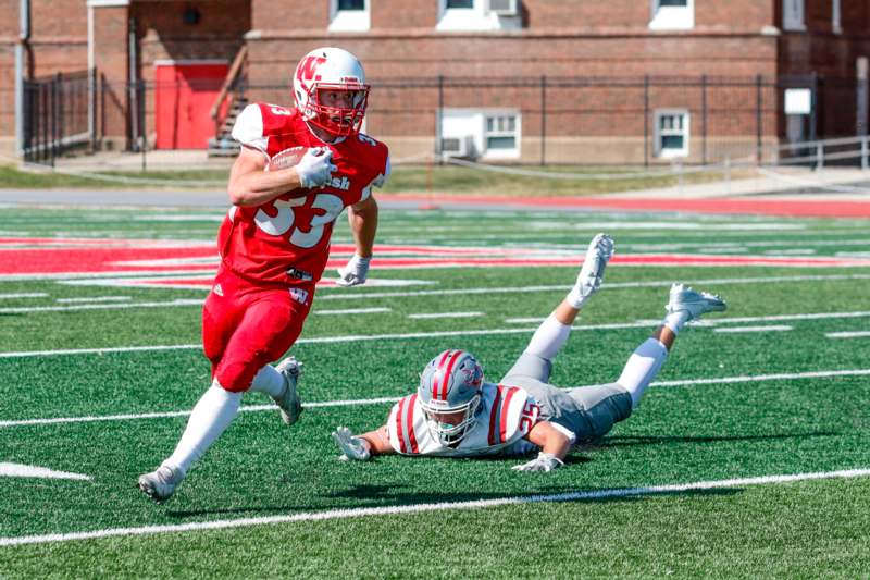 a football player running with the ball