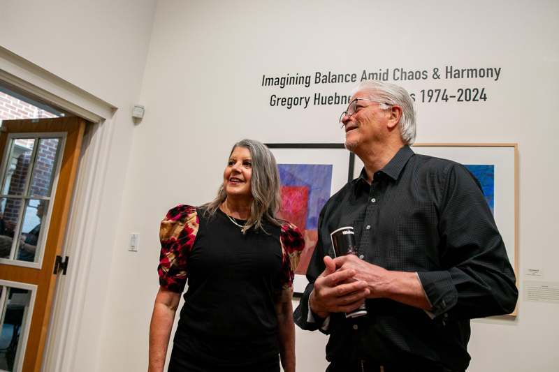 a man and woman standing in a room