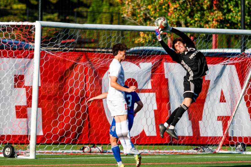 a football player jumping to catch a ball