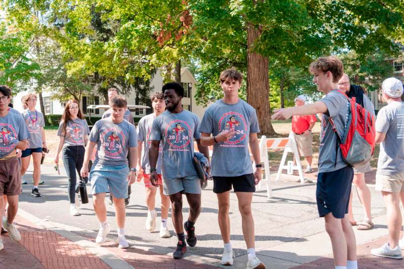 a group of people walking on a street