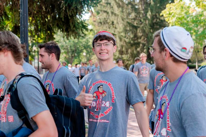 a group of men wearing matching t-shirts