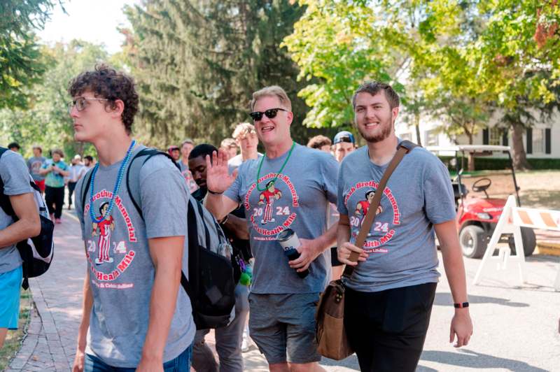 a group of men wearing matching t-shirts