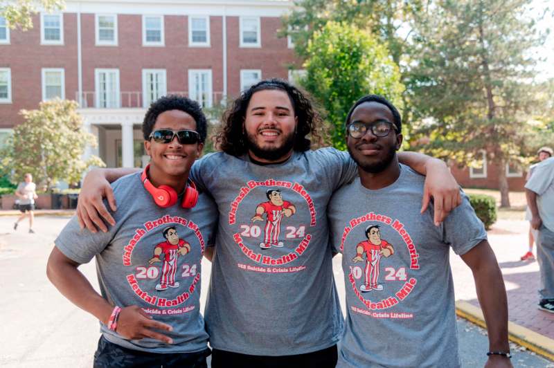 a group of men wearing matching t-shirts