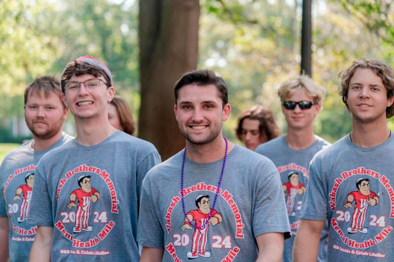 a group of men wearing matching shirts