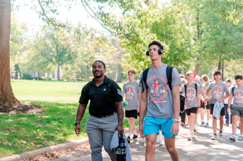 a group of people walking in a park