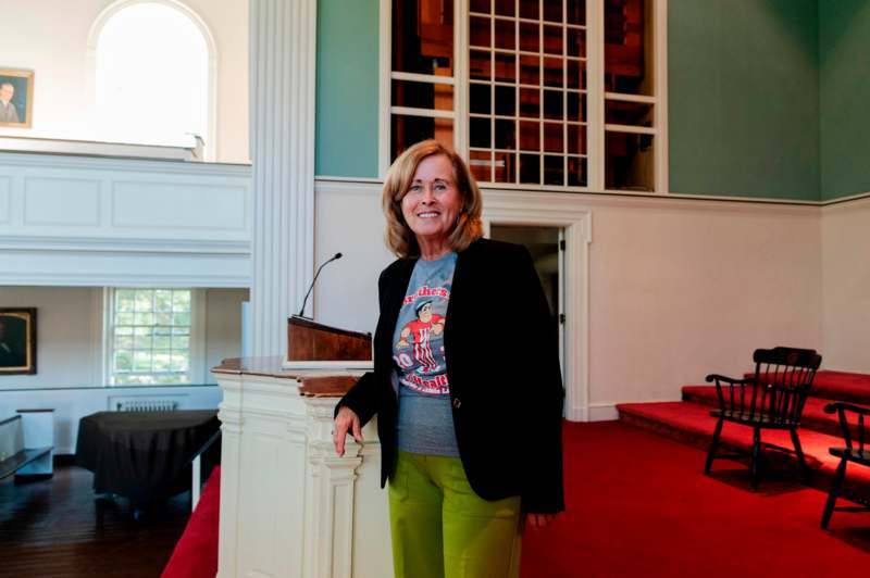 a woman standing in front of a podium