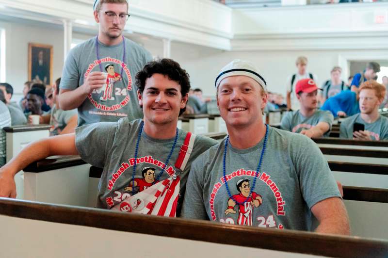 a group of men wearing matching t-shirts