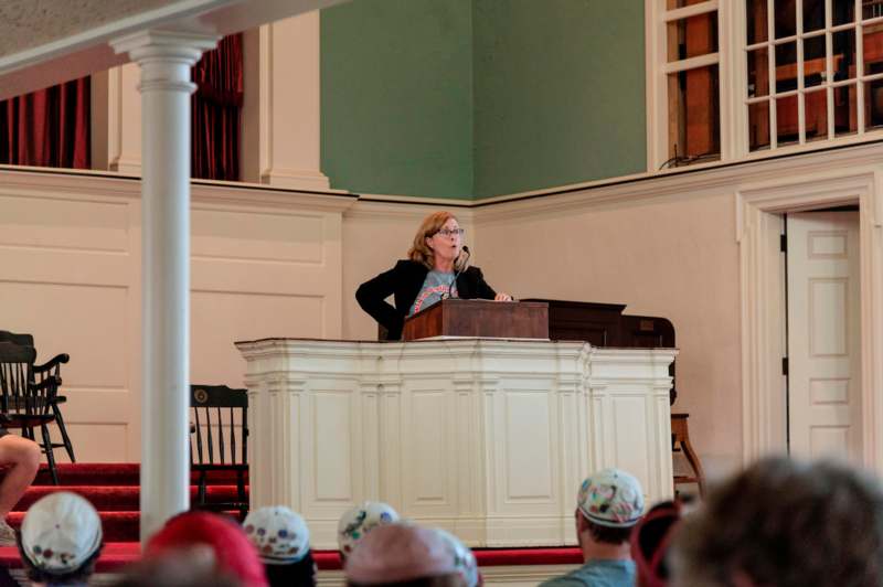 a woman speaking at a podium