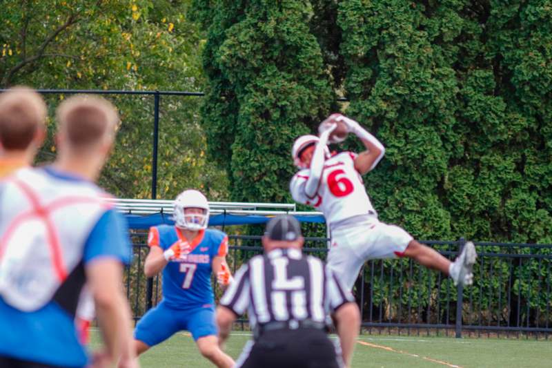 a football player catching a football