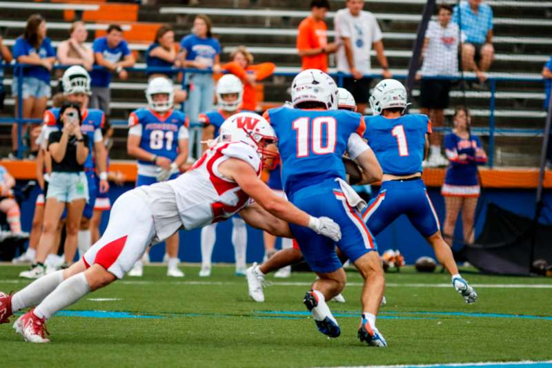 a group of people playing football