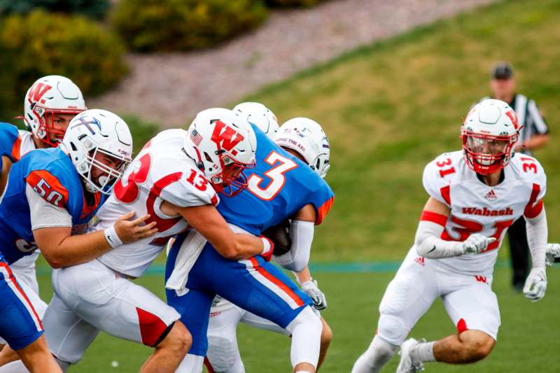 a group of football players in a game