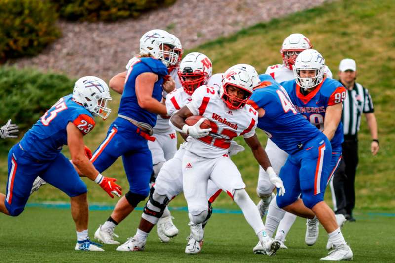 a group of football players on a field