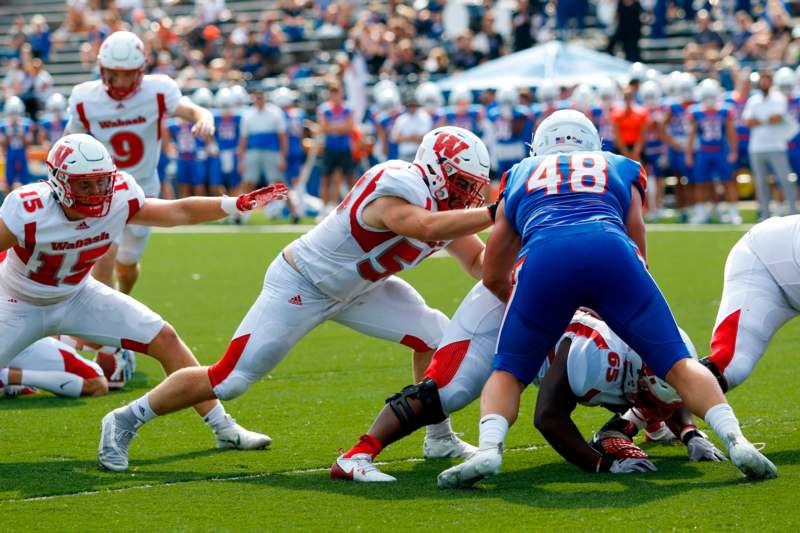 a group of football players on a field