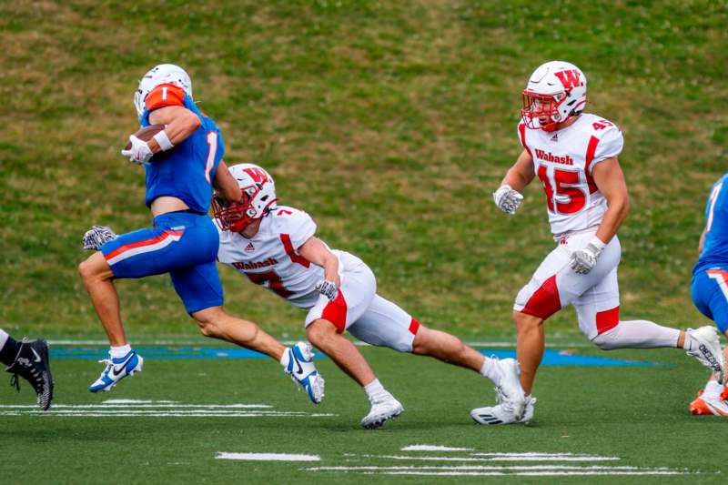 a group of football players running on a field