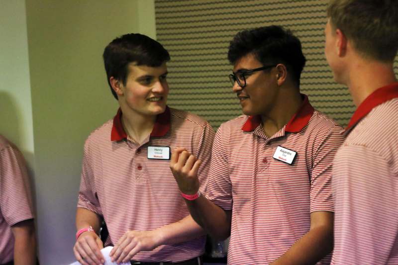 a group of men wearing striped shirts