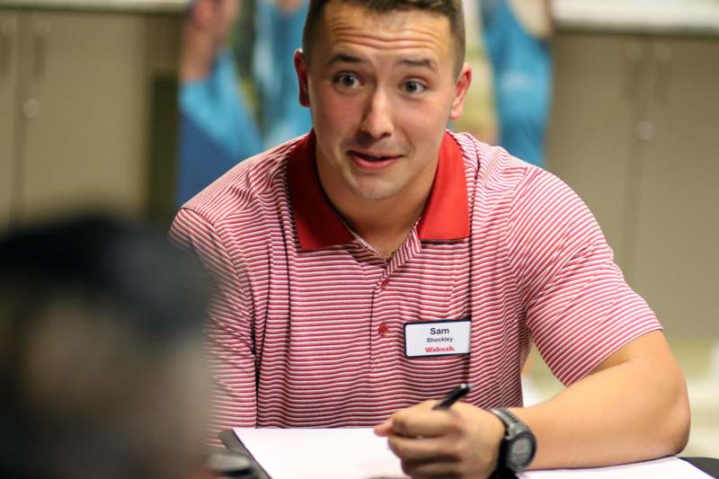 a man in a red and white striped shirt