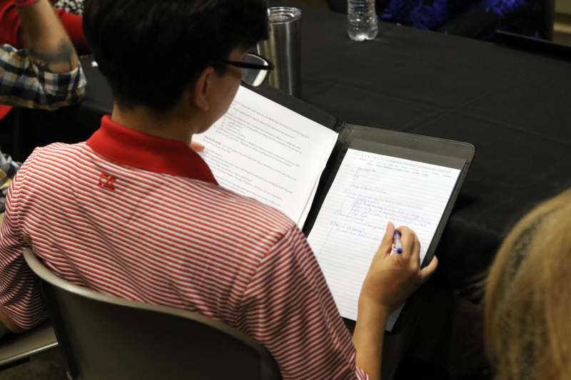 a person writing on a book