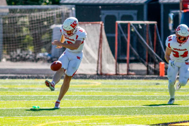 a football player running with a football