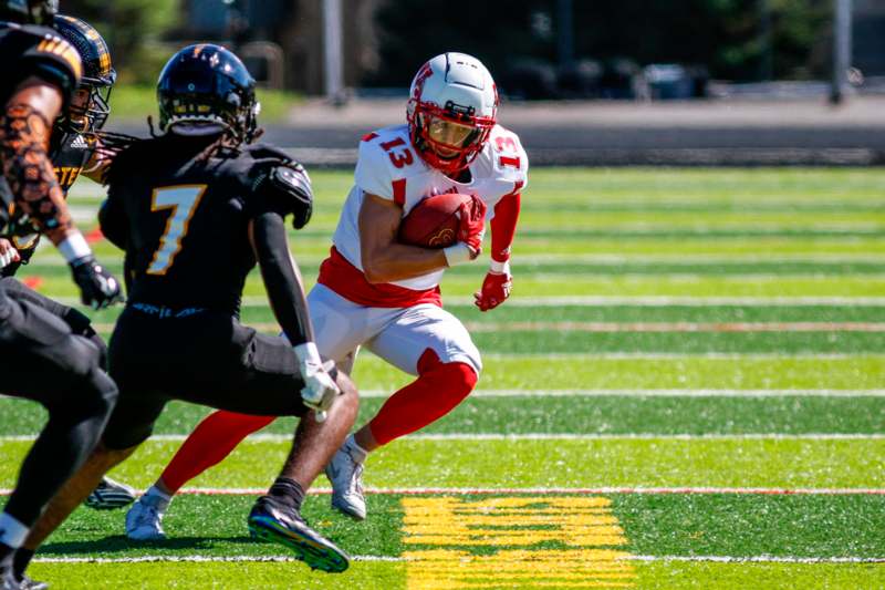 a football player running with the ball