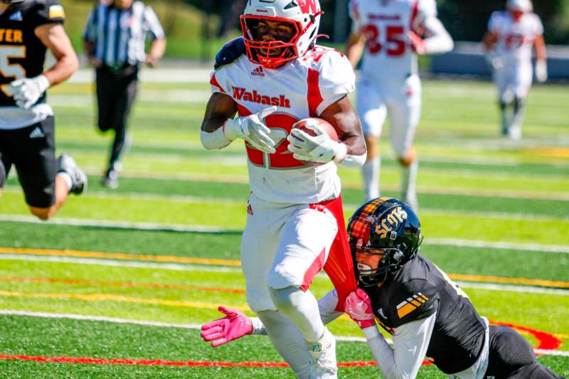 a football player running with the ball