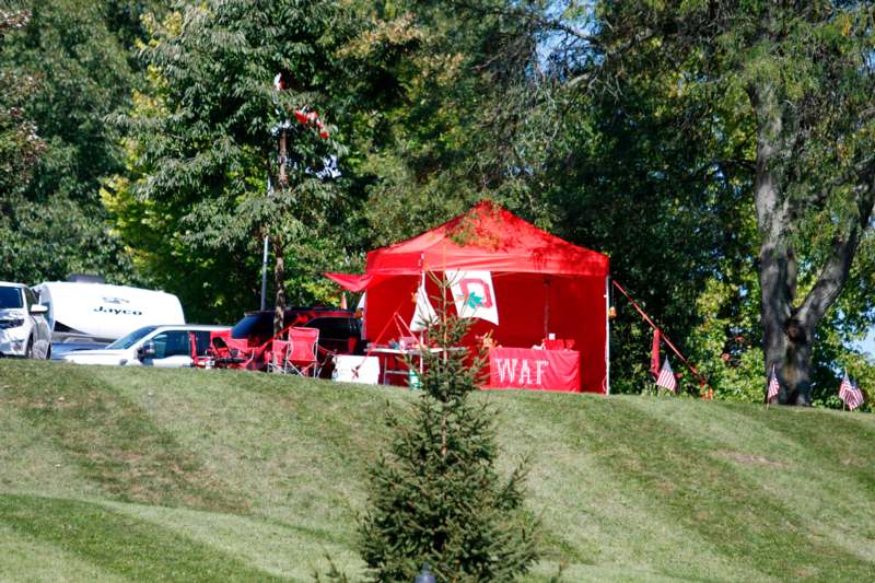 a red tent on a hill