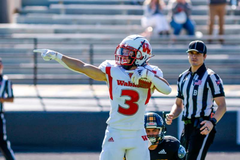 a football player pointing at something