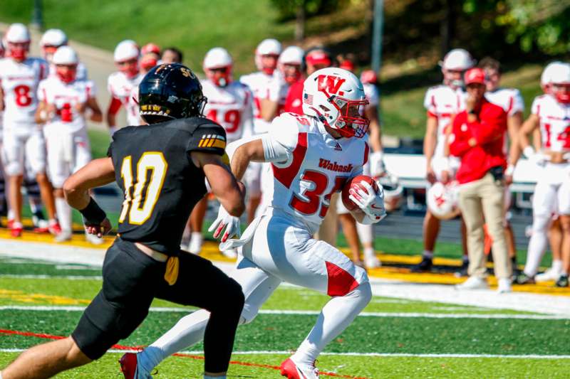 a football player running with the ball