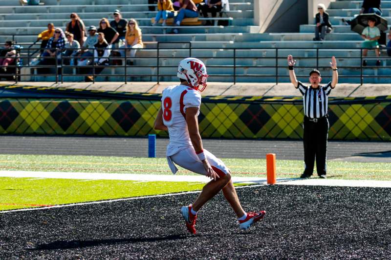 a football player running on a field