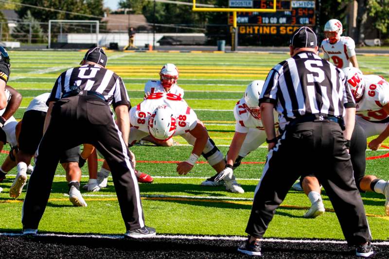 a group of people on a football field