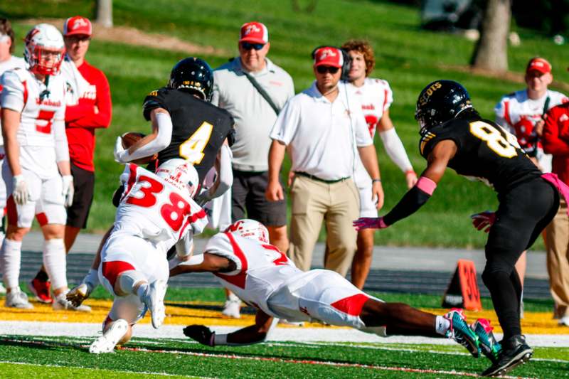 a football player diving for a ball