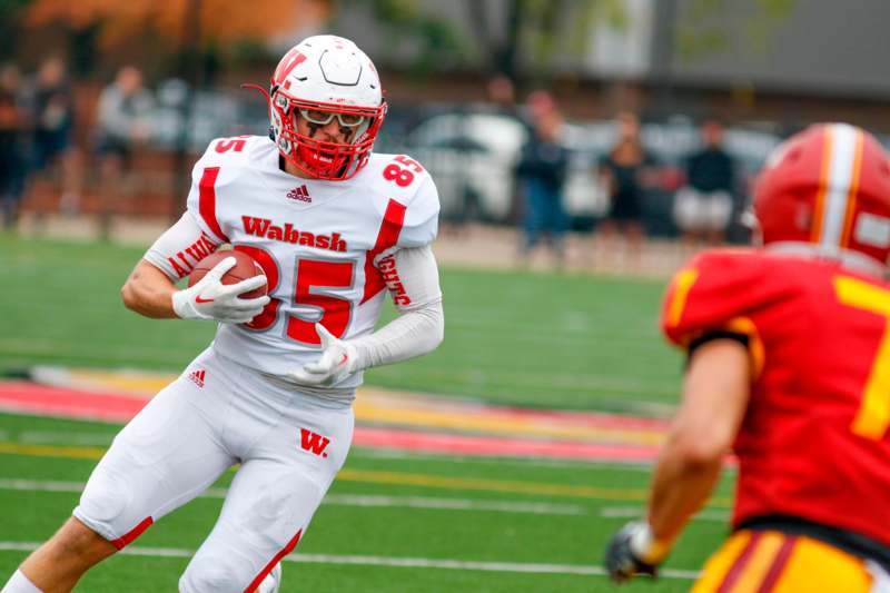 a football player running with a ball