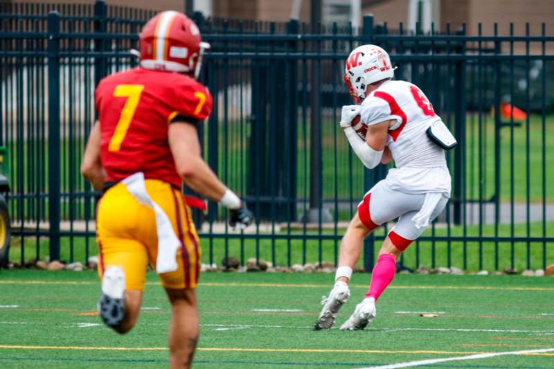 a football player running with the ball