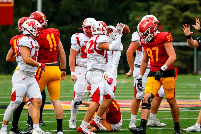 a group of football players on a field