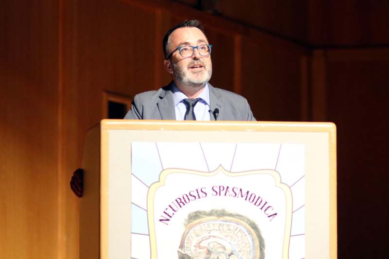 a man standing at a podium