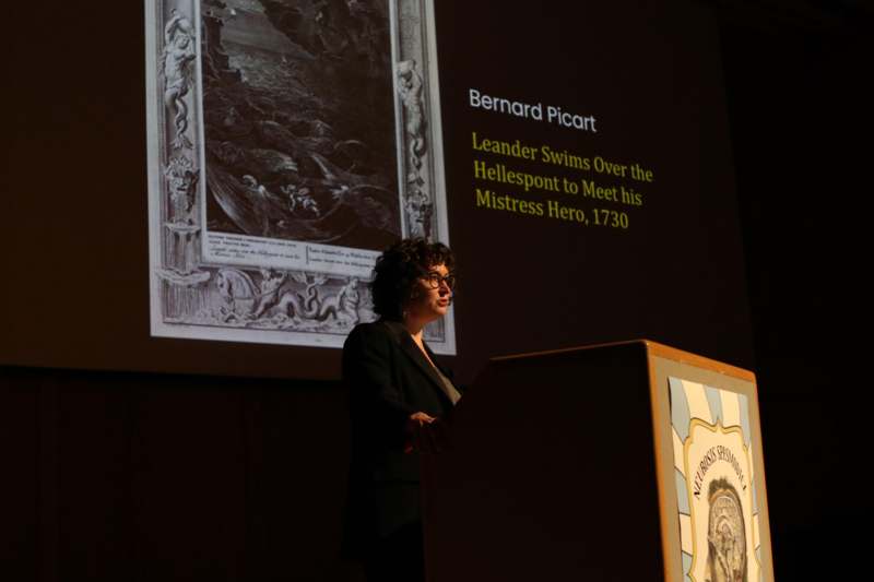 a woman standing at a podium