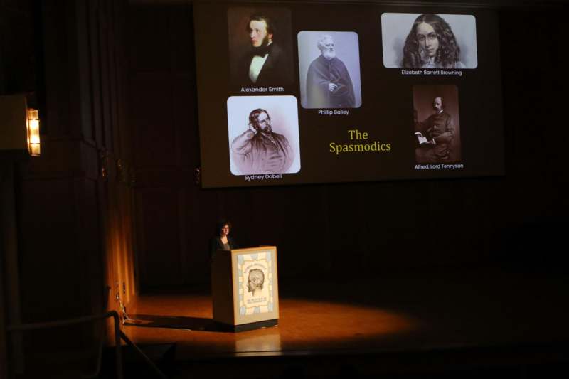 a woman standing at a podium