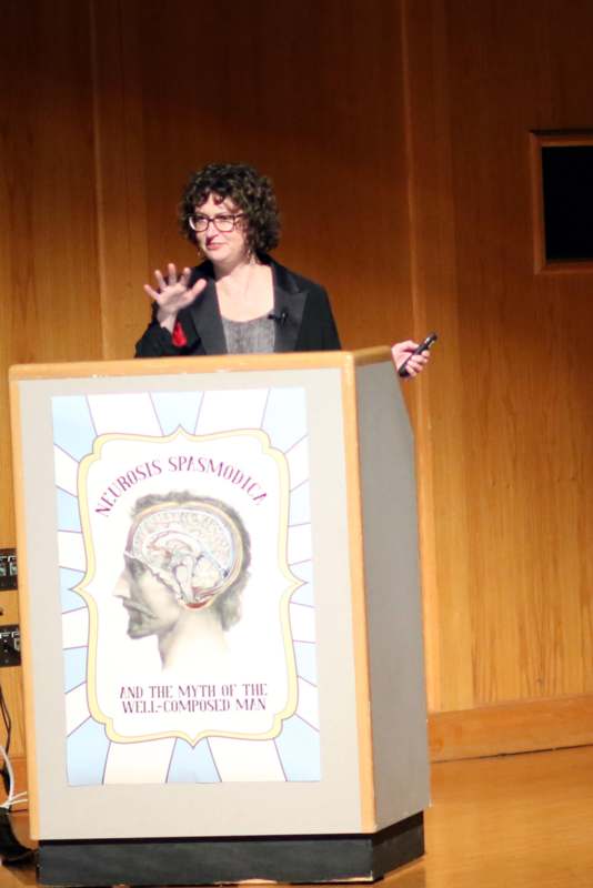 a woman standing at a podium