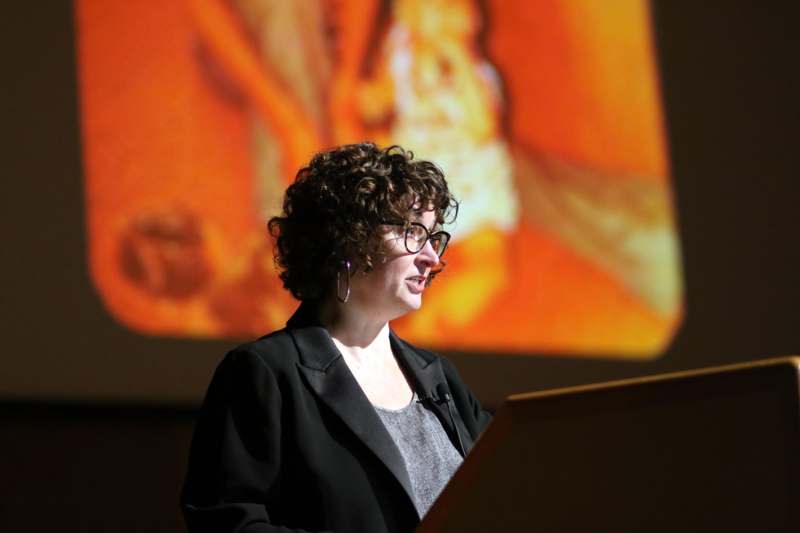 a woman standing at a podium