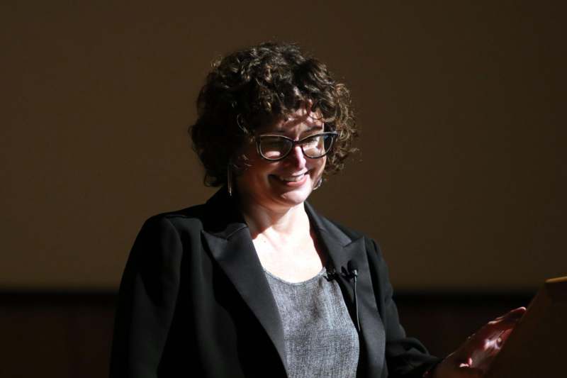 a woman smiling at the camera