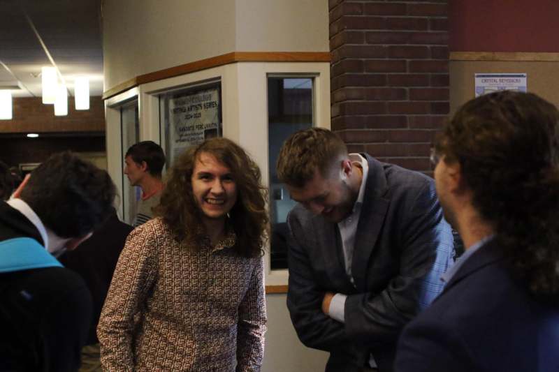 a group of people standing in a room