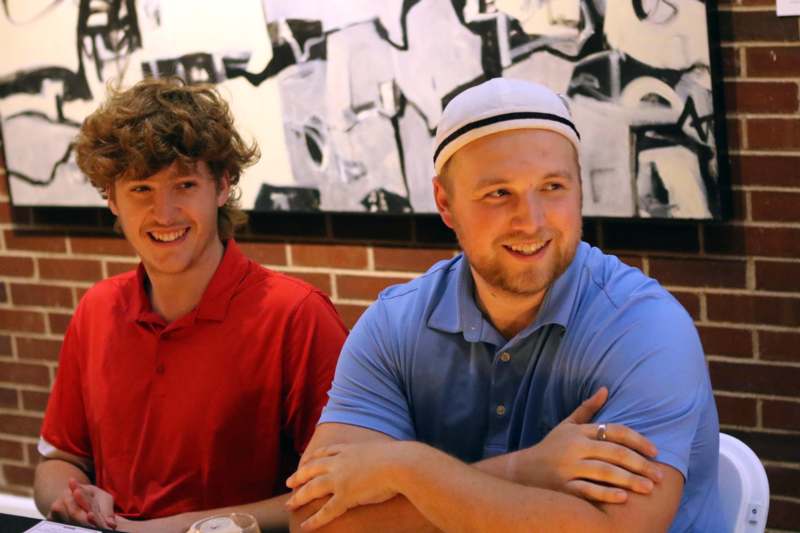 two men sitting at a table