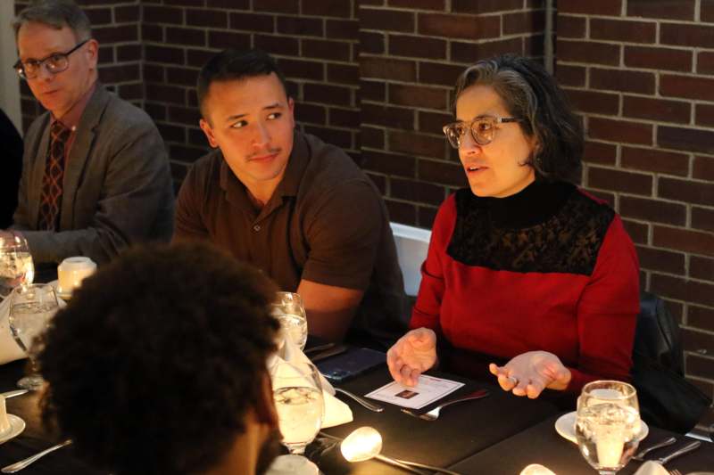 a group of people sitting at a table